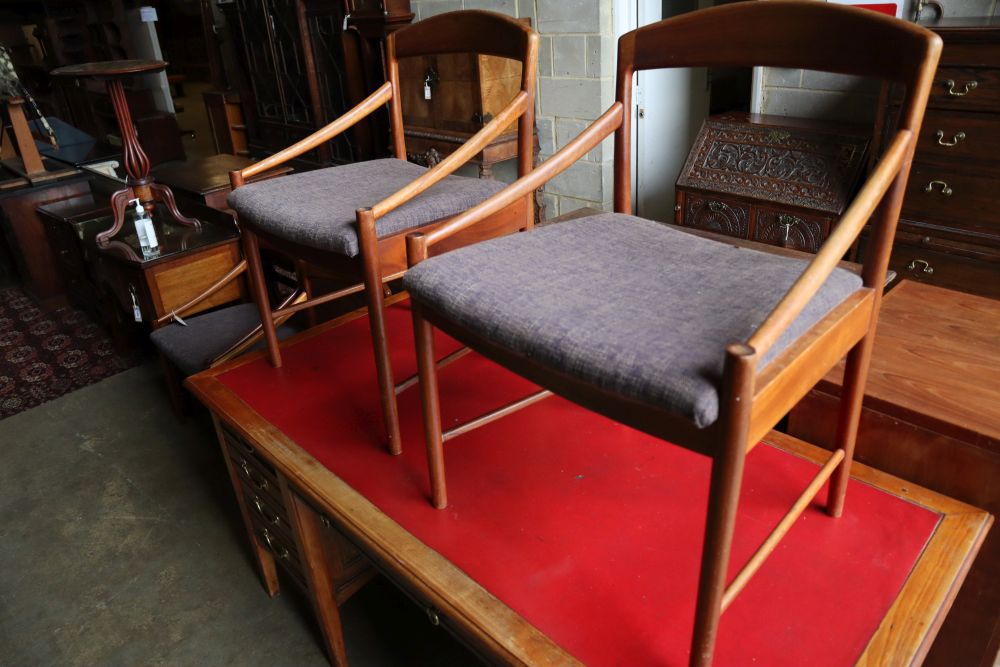 A set of four mid century Danish teak elbow chairs